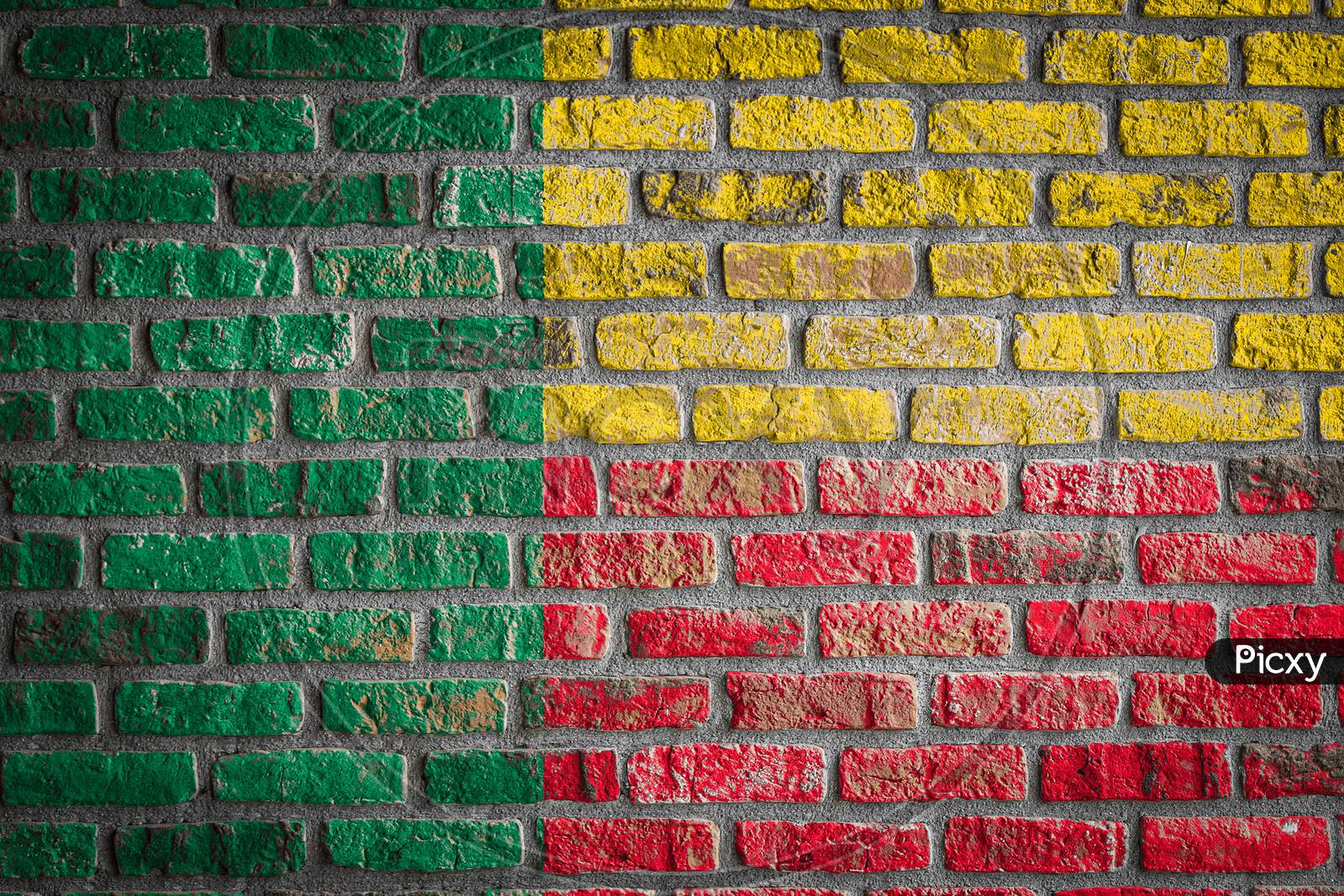 National Flag Of Benin Depicting In Paint Colors On An Old Brick Wall. Flag  Banner On Brick Wall Background.