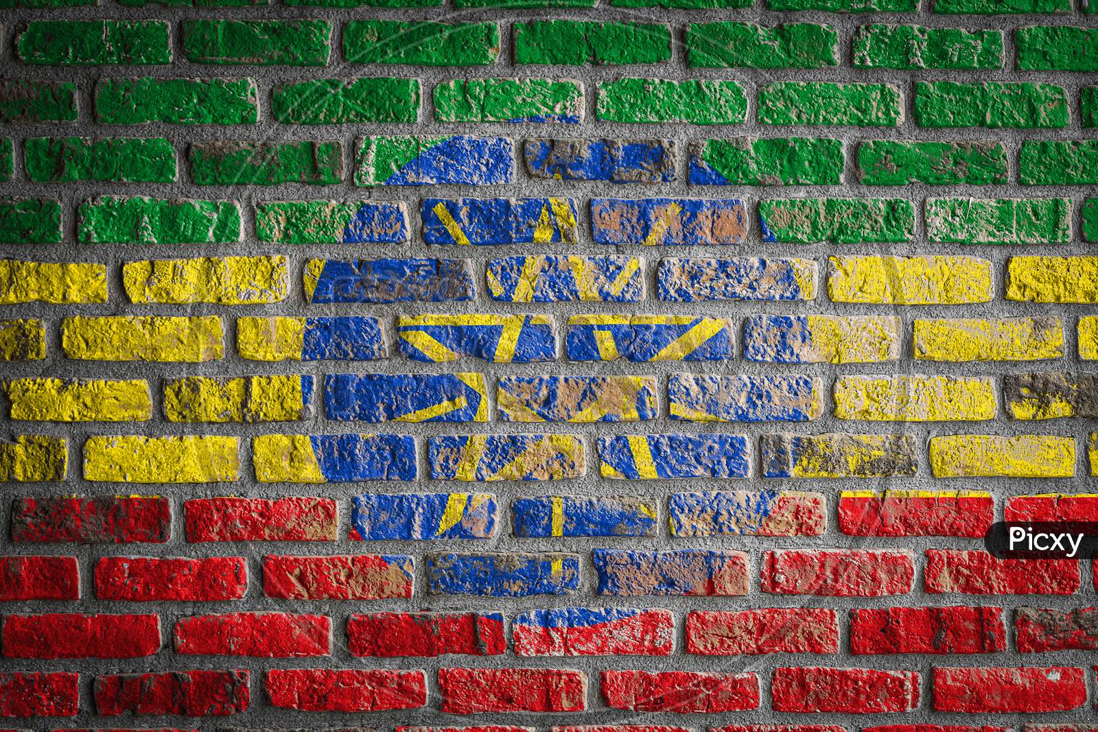 National Flag Of Ethiopia Depicting In Paint Colors On An Old Brick Wall. Flag  Banner On Brick Wall Background.