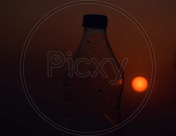 Beautiful Picture Of Water Bottle. Sunset In Background