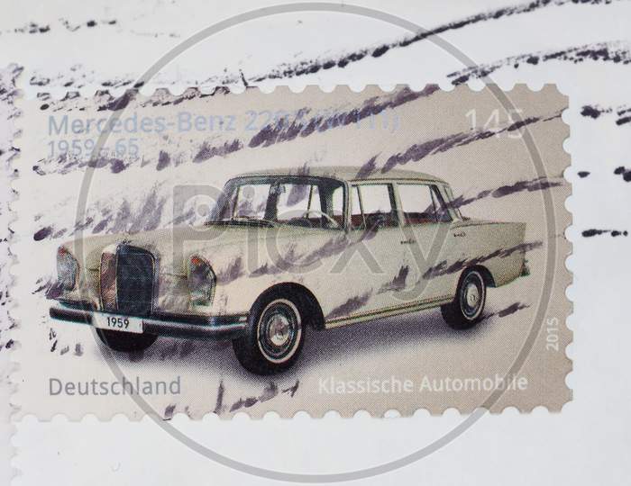 Berlin, Germany - July 31, 2015: Stamps Printed By Germany Show A Classic Mercedez Benz Car