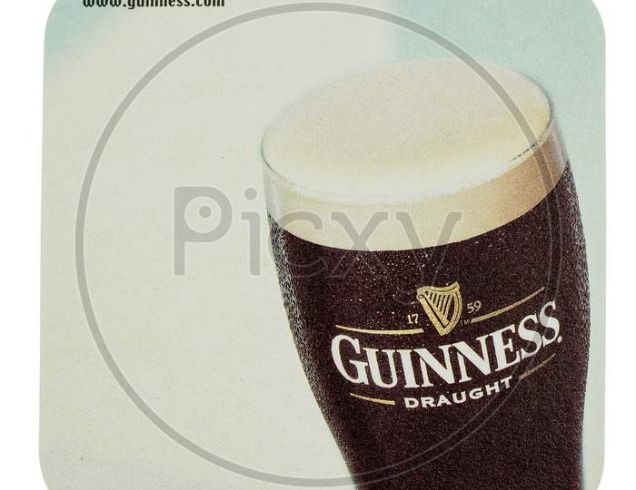 Dublin, Ireland - March 15, 2015: Beermat Of Irish Beer Guinness Isolated Over White Background