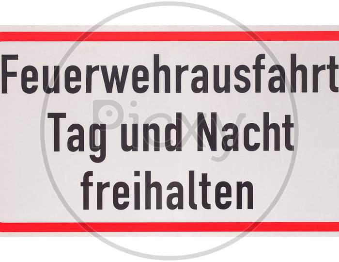 German Sign Isolated Over White. Fire Department Exit, Keep Clear Day And Night