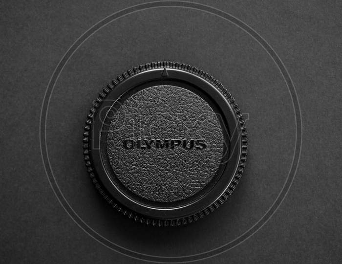 Olympus Logo On Lens Cap With Copy Space In Tokyo, Japan