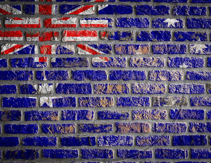 National Flag Of Australia
Depicting In Paint Colors On An Old Brick Wall. Flag  Banner On Brick Wall Background.
