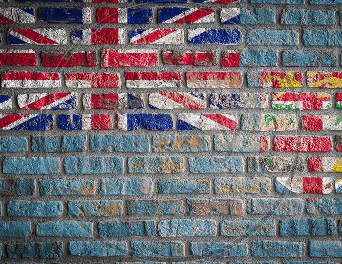National Flag Of Fiji Depicting In Paint Colors On An Old Brick Wall. Flag  Banner On Brick Wall Background.