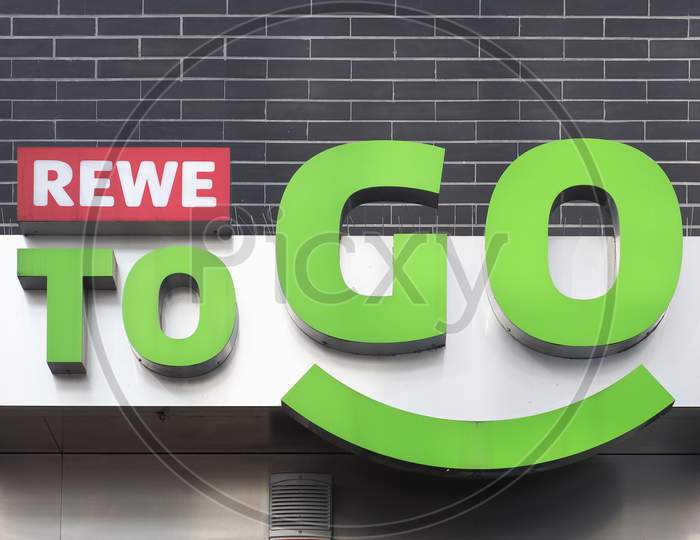 Koeln, Germany - Circa August 2019: Rewe To Go Sign