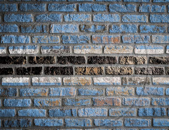 National Flag Of Botswana
 Depicting In Paint Colors On An Old Brick Wall. Flag  Banner On Brick Wall Background.
