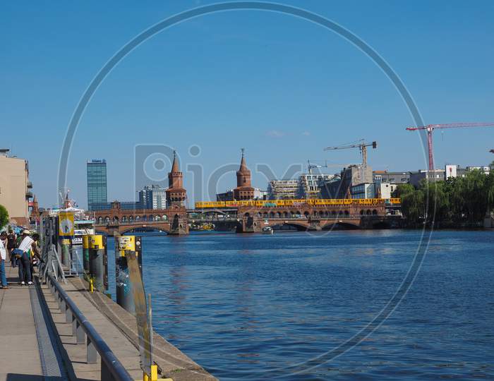 Berlin, Germany - Circa June 2019: Oberbaumbruecke (Oberbaum Bridge) Double Deck Bridge Crossing River Spree