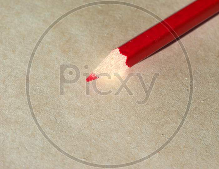Red Pencil Over Paper
