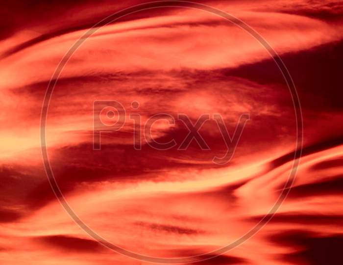 Red Sunset Sky With Clouds Background