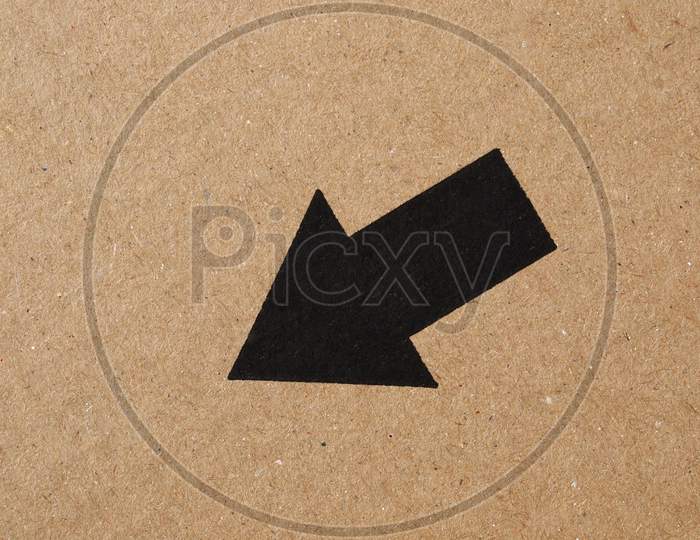 Black Arrow On Cardboard