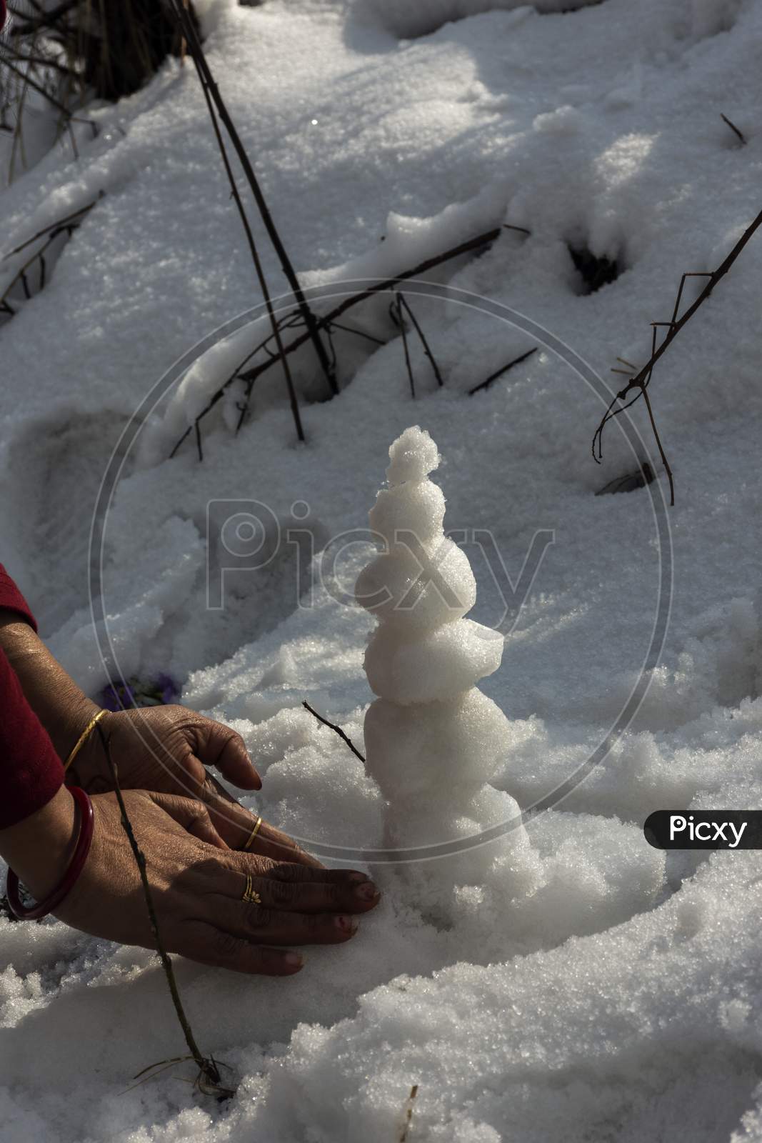 Tourist Made Small Snow Man With Ice While After Snowfall.