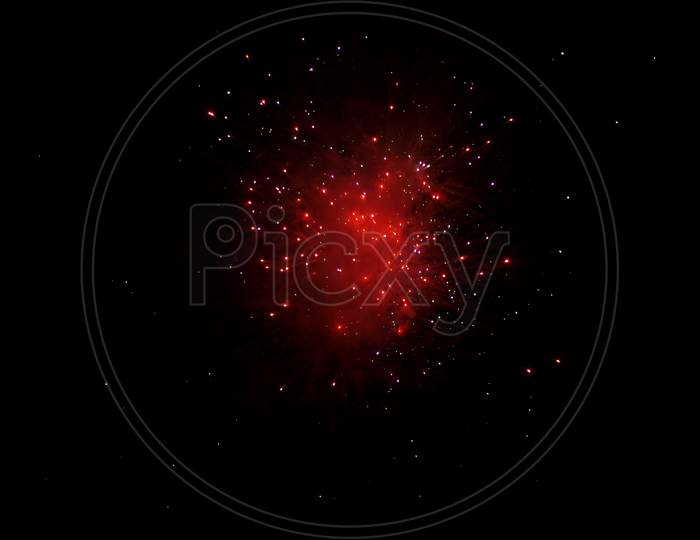 Red Fireworks Over Black Sky