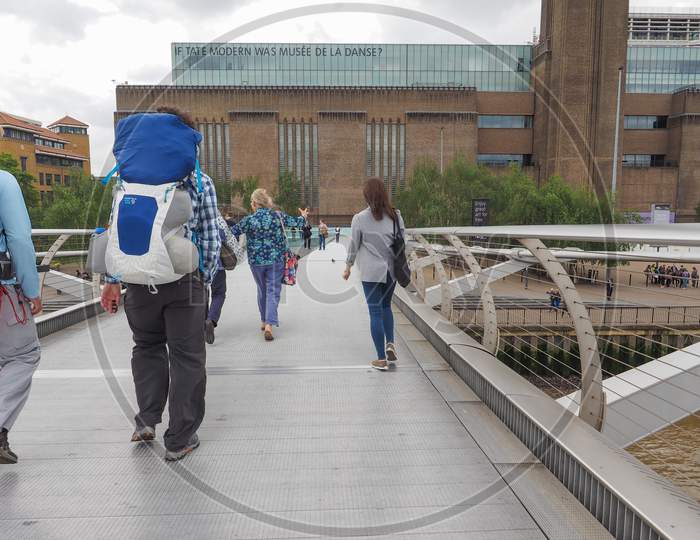 London, Uk - June 10, 2015: People Crossing The Millennium Bridge Linking The City Of London With The South Bank Between St Paul Cathedral And Tate Modern Art Gallery