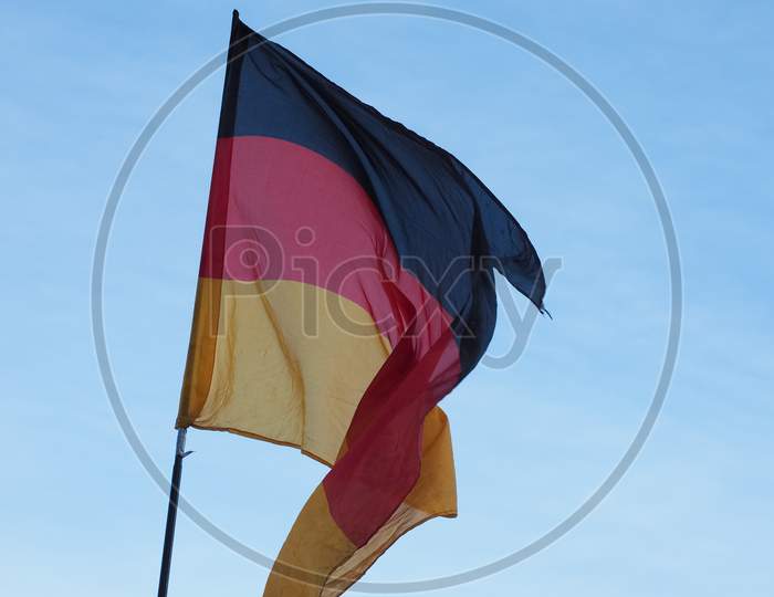 German Flag Of Germany Over Blue Sky