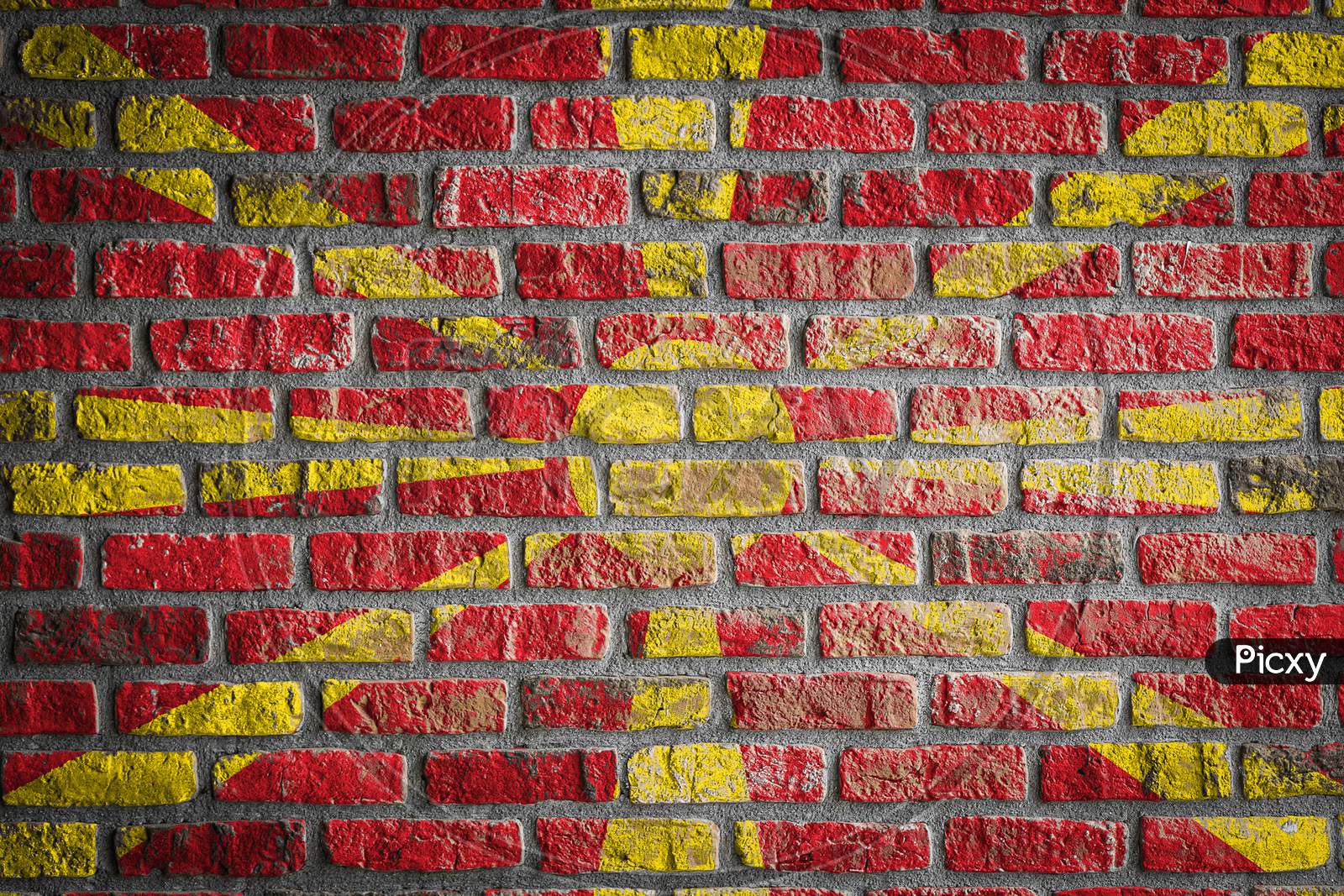 National Flag Of Macedonia Depicting In Paint Colors On An Old Brick Wall. Flag  Banner On Brick Wall Background.