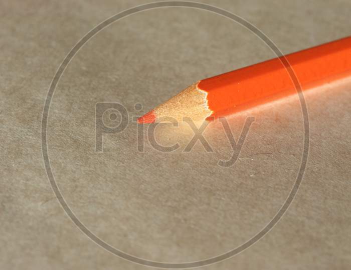 Orange Pencil Over Paper