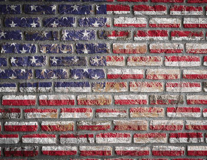 National Flag Of Usa
 Depicting In Paint Colors On An Old Brick Wall. Flag  Banner On Brick Wall Background.