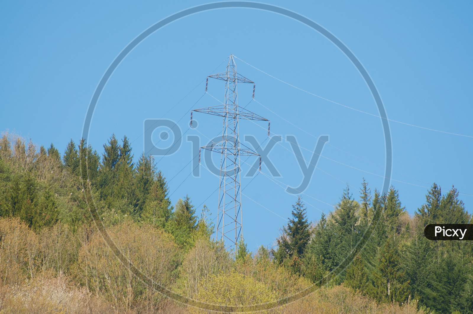 High Voltage Electric Transmission Tower In Swiss Mountain