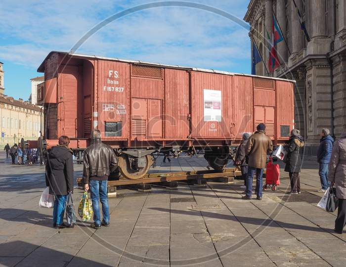 Turin, Italy - January 23, 2015: People Visiting An Holocaust Train For Deportation Of Jews To Concentration Forced Labour And Extermination Camps To Mark The Primo Levi Exhibition In Piazza Castello