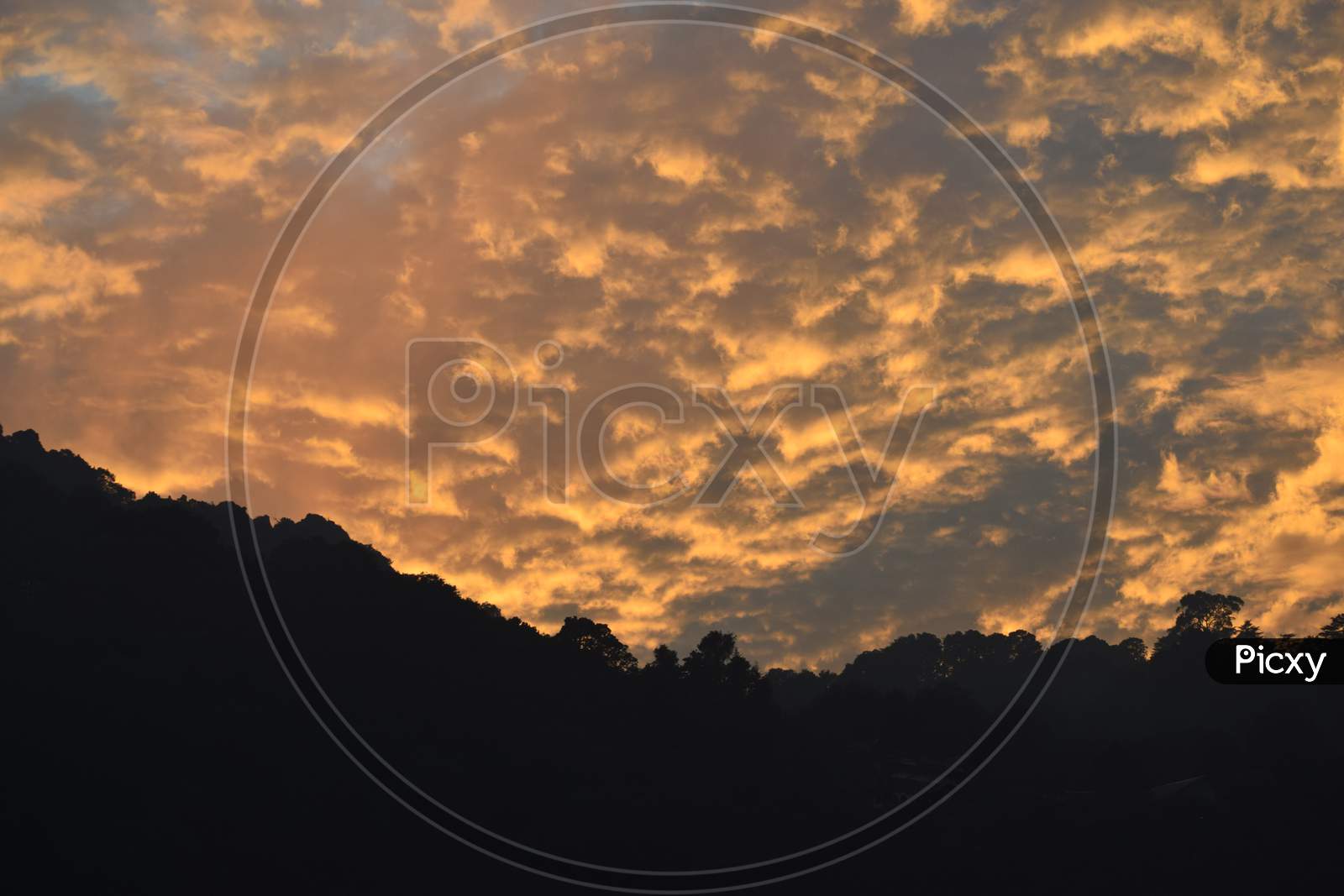 Beautiful Picture Of Orange Clouds In Mountain After Sunset