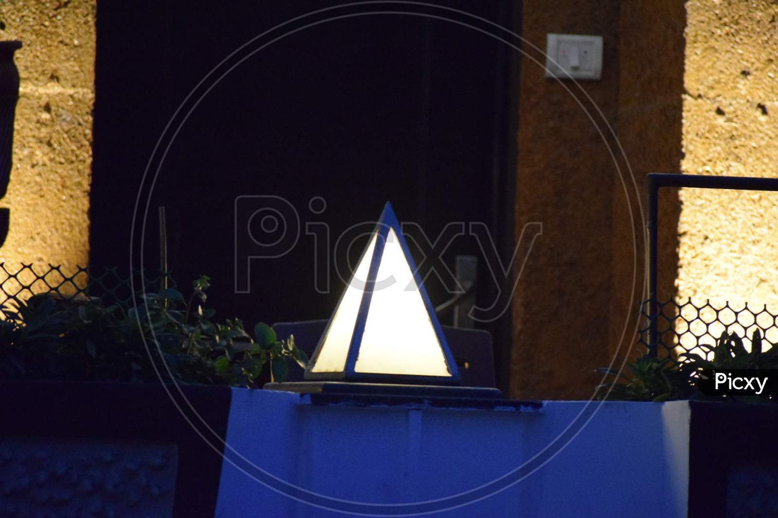 Beautiful Picture Of White Gate Lamp. Background Blur