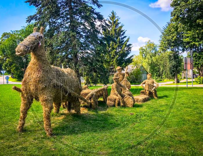 Lithuania, Zarasai - 25Th July, 2018: Hand Made Hay Figures Of Horse And Musicians In Green Countryside Lithuania.