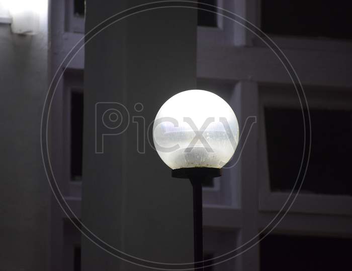 Beautiful Picture Of White Gate Lamp. Background Blur