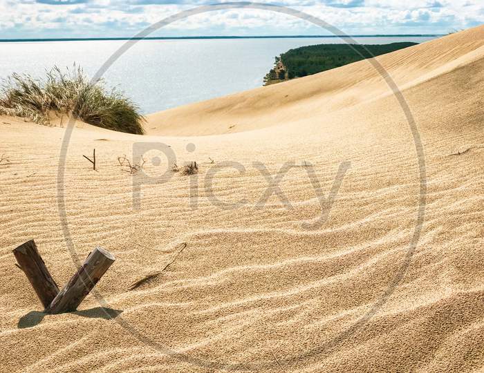 Baltic Sea Curonian Spit Sand-Dunes, Unesco World Heritage Site. Beautiful Texture Sand With Tranquil Sea Background In Summer. Travel Destination Lithuania.