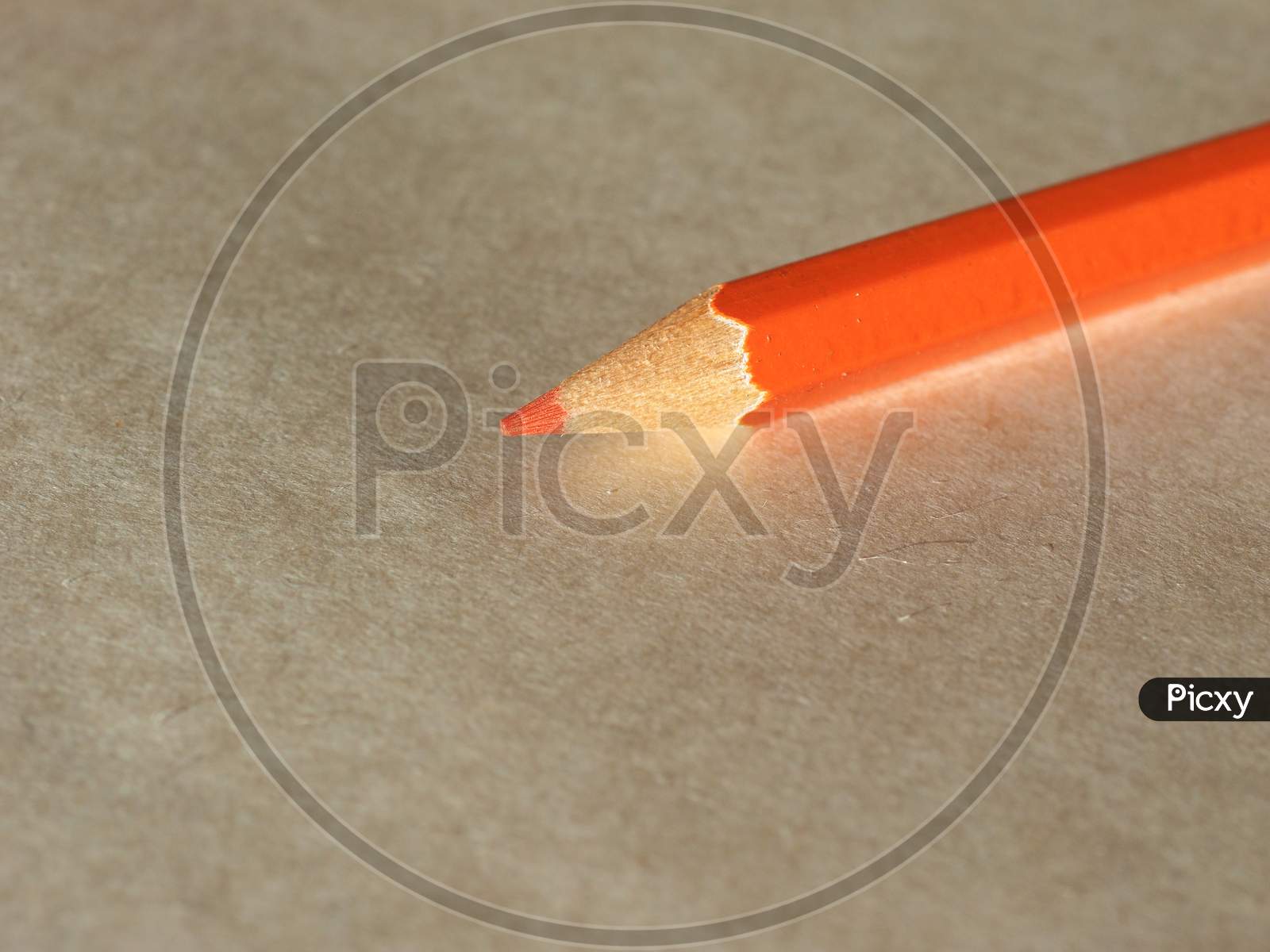 Orange Pencil Over Paper