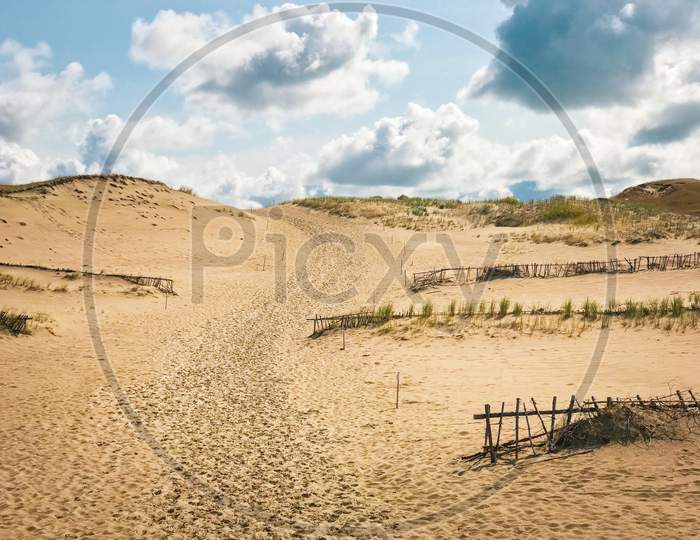 Grey Dunes In Summer Time And Sky Background. Beautiful Natural Beauty Of Curonian Spit, Lithuania.