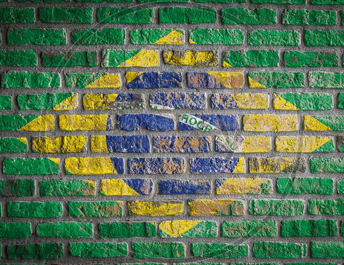 National Flag Of Brazil
 Depicting In Paint Colors On An Old Brick Wall. Flag  Banner On Brick Wall Background.