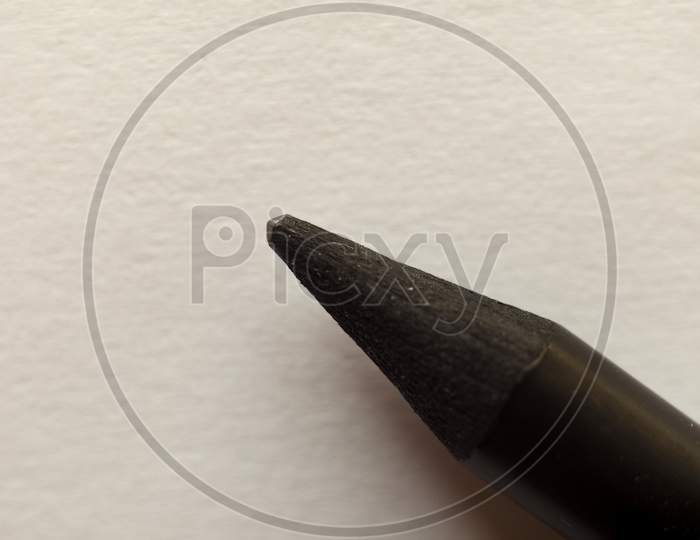 Tip Of A Pencil Over Paper With Copy Space