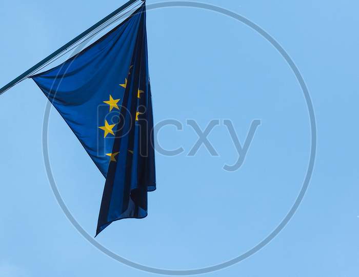 Flag Of The European Union (Eu) Over Blue Sky