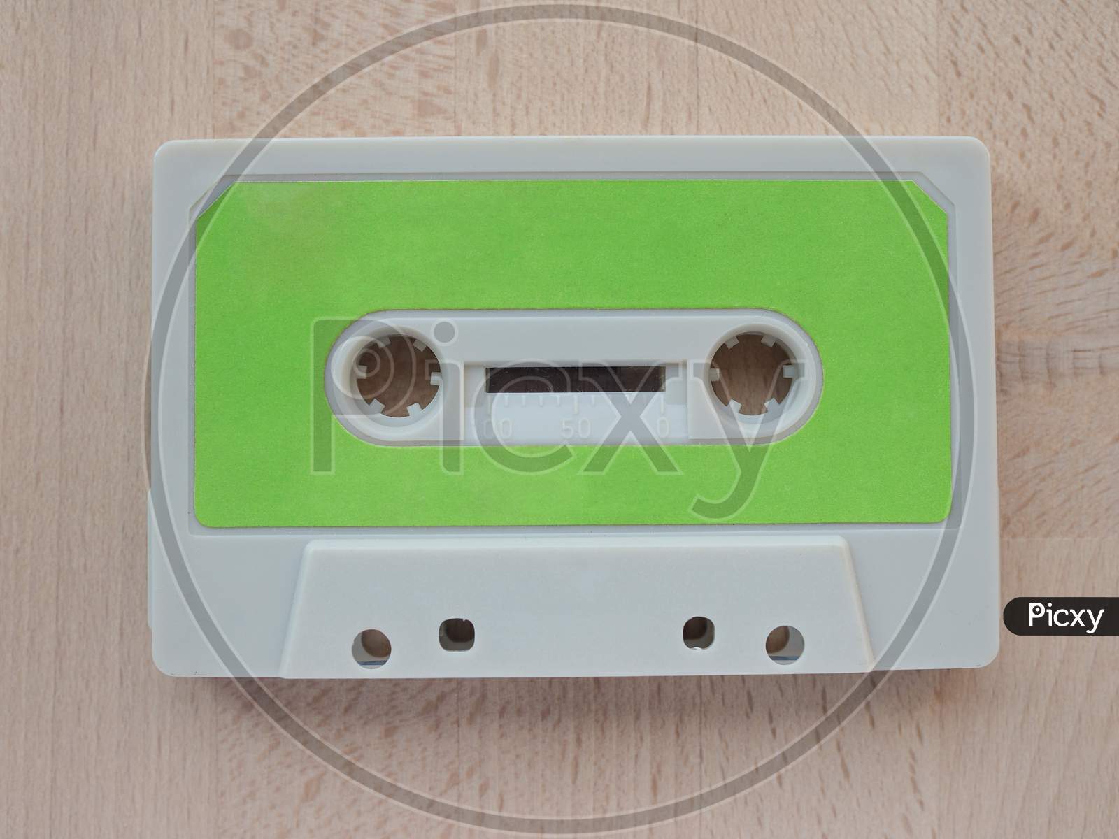 Tape Cassette On Wooden Desktop