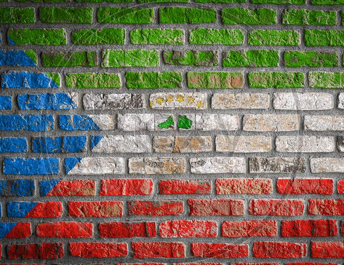 National Flag Of Equatorial Guinea
 Depicting In Paint Colors On An Old Brick Wall. Flag  Banner On Brick Wall Background.