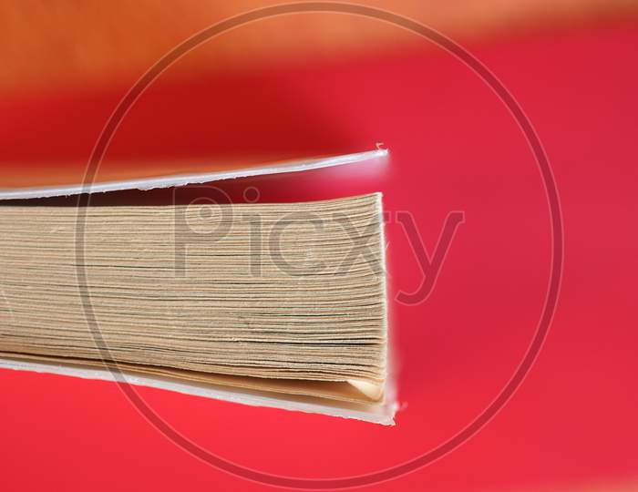 Book Pages Over Red