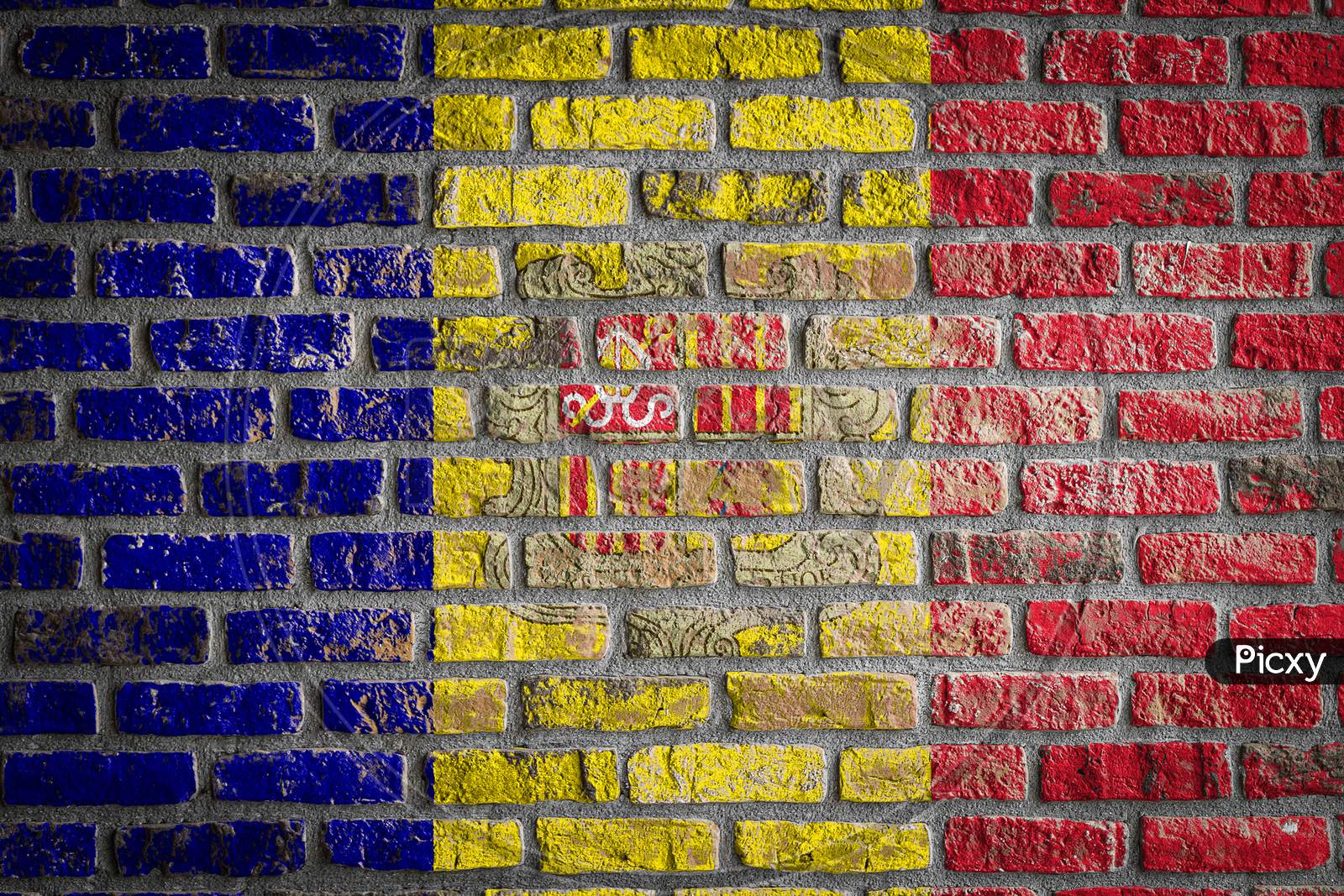 National Flag Of Andorra
 Depicting In Paint Colors On An Old Brick Wall. Flag  Banner On Brick Wall Background.