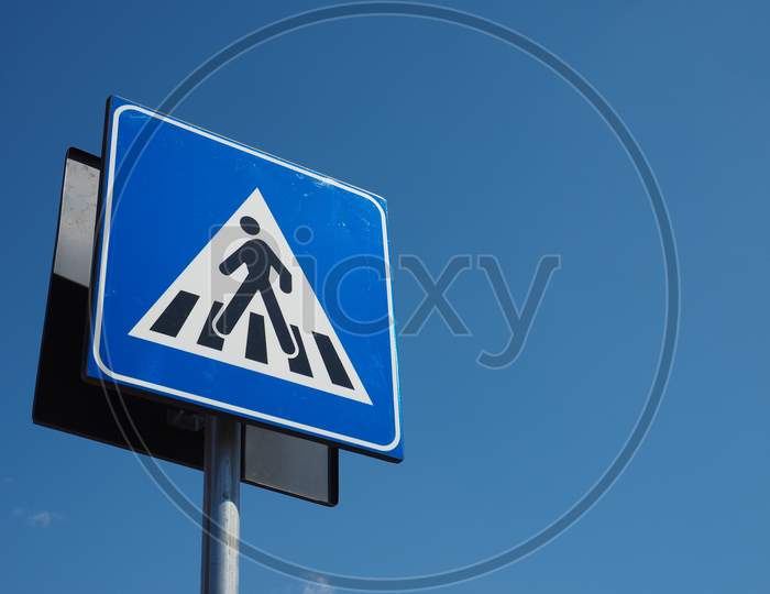Zebra Crossing Sign Over Blue Sky