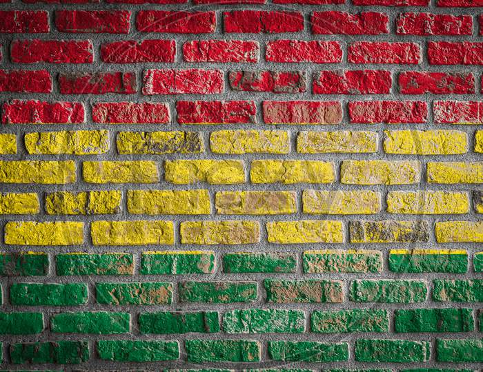 National Flag Of Bolivia
 Depicting In Paint Colors On An Old Brick Wall. Flag  Banner On Brick Wall Background.