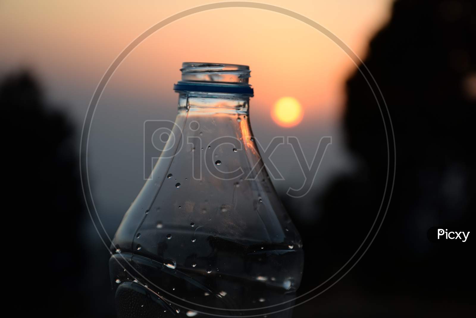 Picture Of A Water Bottle And Sunset In Background, Background Blur