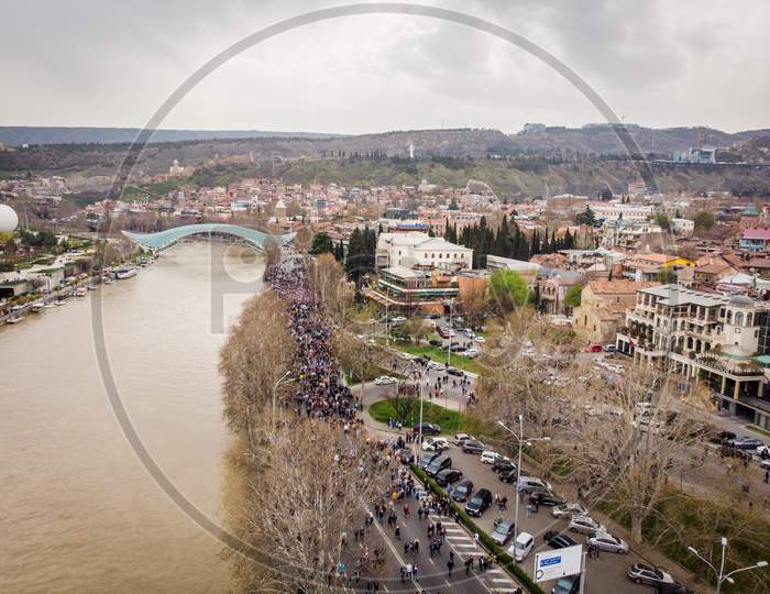 People Walking In Streets In Georgia Capital. Aerial View Tbilisi Tragedy Anniversary Demonstration.