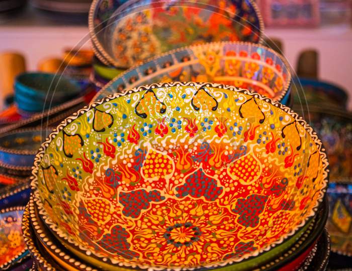 Classical Turkish Ceramics On The Istanbul Grand Bazaar. Colorful Ceramic Plates For Sale In Turkey. Decorated Tableware In The Tourist Store. Souvenir Shop