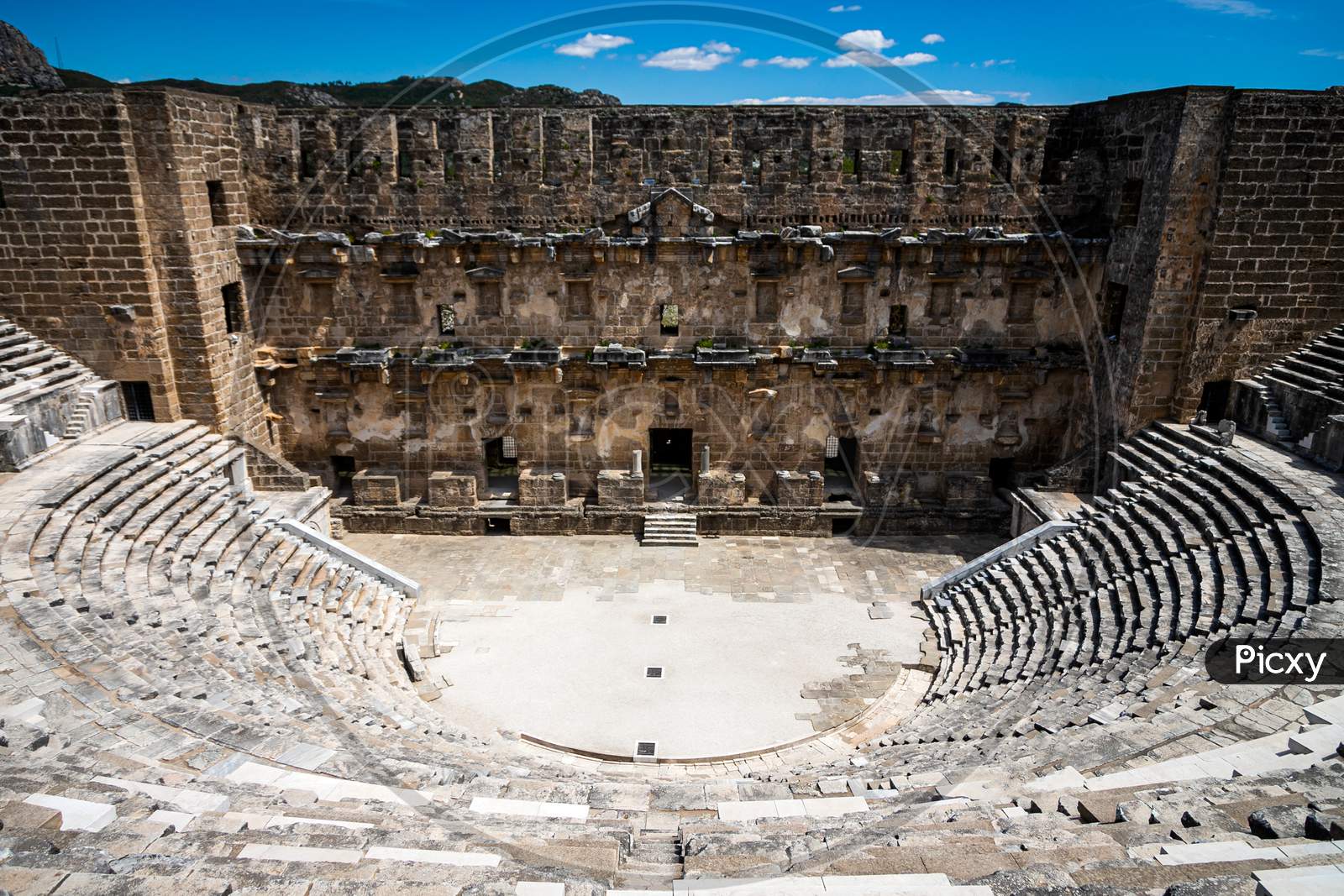Roman Amphitheater Of Aspendos Ancient City Near Antalya, Turkey. An Antique Ruined City