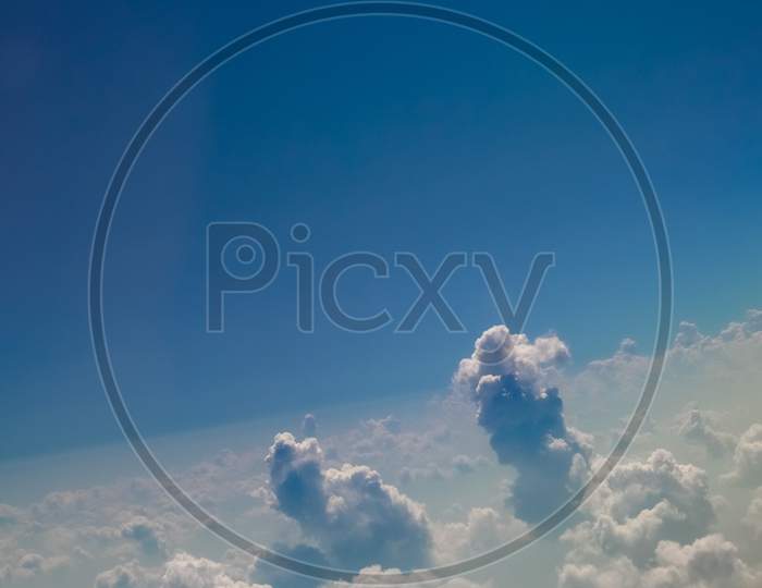 Blue Sky With Clouds Background Seen From Flying Plane