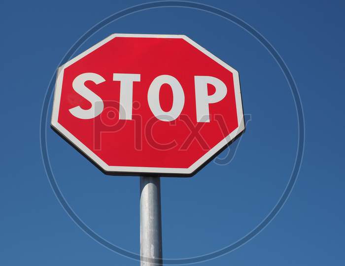 Stop Sign Over Blue Sky