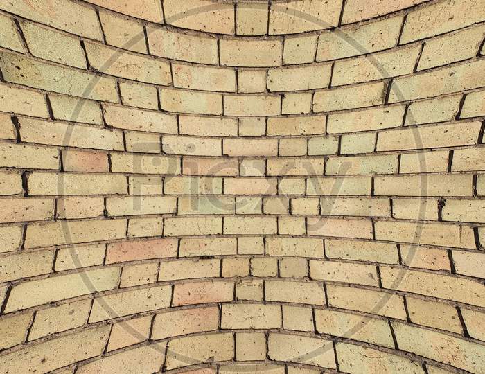 Curved Yellow Brick Wall Background