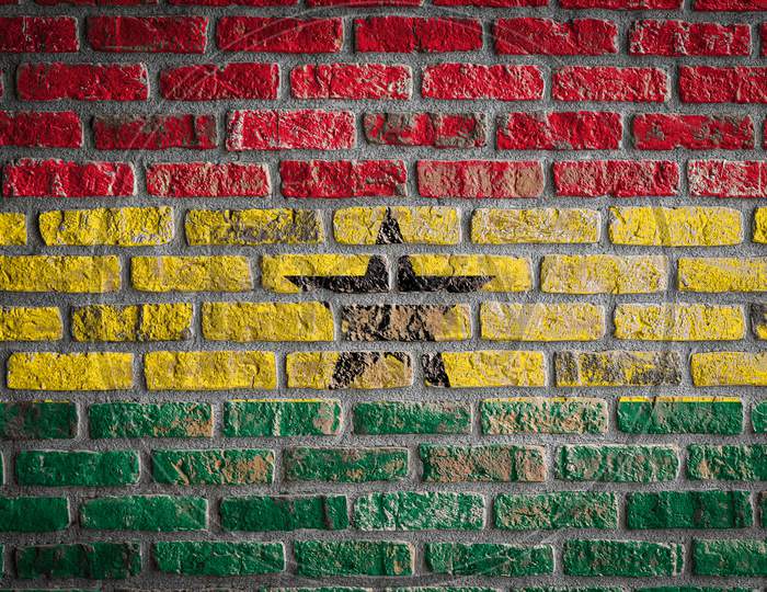 National Flag Of Ghana
 Depicting In Paint Colors On An Old Brick Wall. Flag  Banner On Brick Wall Background.