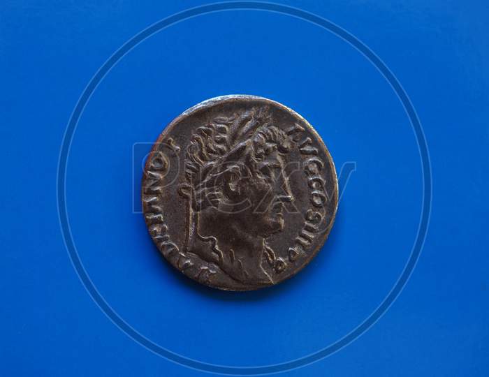 Vintage Roman Coin Over Blue