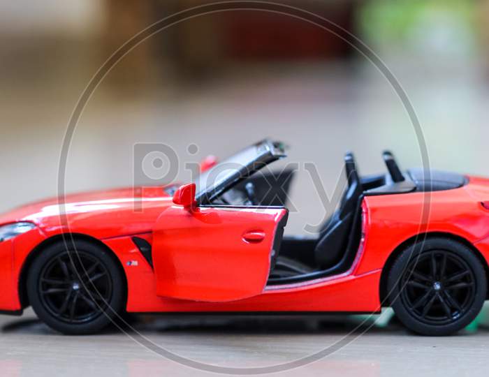 Side View of Convertible Red BMW Sport Car